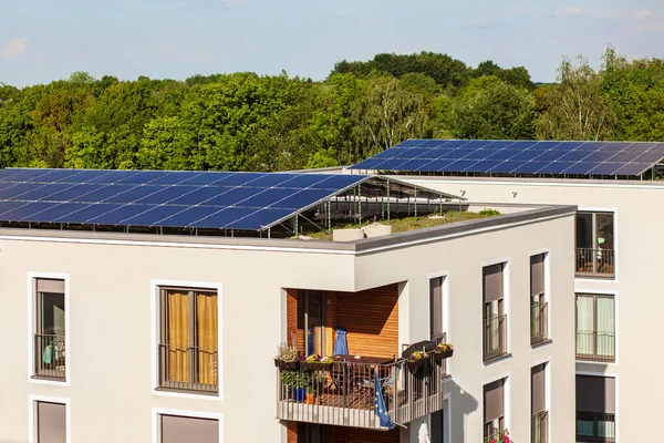 Solar Panel on House Roof. Solar Home. High-rise Buildings with Solar Panels on Roof