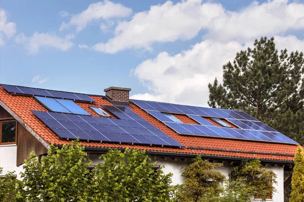 Solar panels on House. Modern private house with Solar Panels on Roof. Eco house.