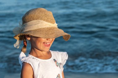 Sea Children Vacation. Happy Smiling Child in Sun Hat in Sea Background. Sea Kid Portrait.