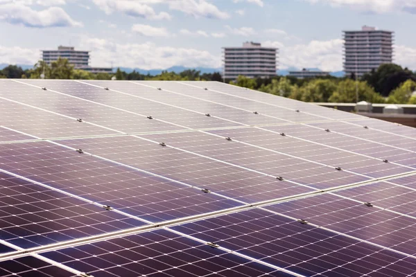 Solar Panel Station Rooftop on Skyscraper city background. Solar Panels System close up.