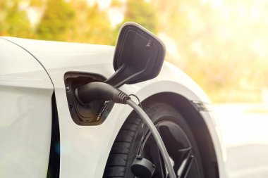 Electric car charged at charging station. Charge EV car vehicle
