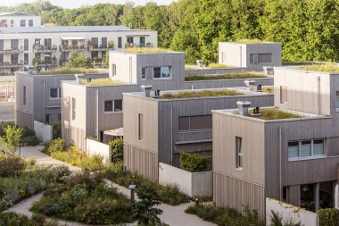 Munchen, Germany - 08.18.2022: Modern residential Area view. Residential buildings with green Rooftop Garden, green Courtyard. Urban landscape with residential buildings
