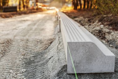 Curbs  installing in Urban Park. Laying Border, Construction Road Works, Paving Curb.