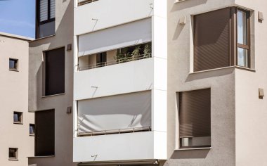 Blinds on Window Outdoor Shutters on Balcony of House. Sun Protection External Shutters on Facade of Modern Residential Building.