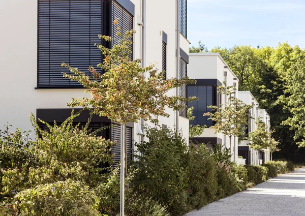 Townhouses with Modern Facade External Blinds. Landscaping Residential low-rise Building sector. Buildings Landscape.