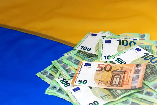 Donate Money Help Ukraine. Euro Financial Assistance Ukraine on Ukrainian Flag