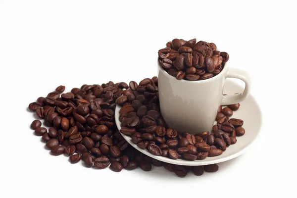 Cup with coffee beans — Stock Photo, Image