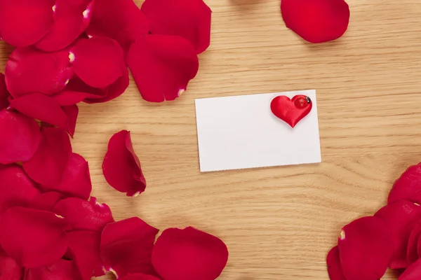 Card and rose petals with a blank space — Stock Photo, Image