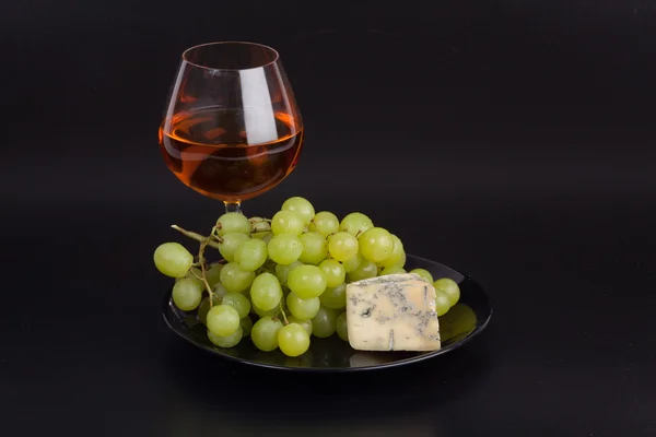 Grape with vine and cheese — Stock Photo, Image