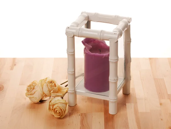 Purple Burning candle in a candlestick — Stock Photo, Image