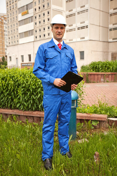 Portrait of a young construction worker outside with hard hat