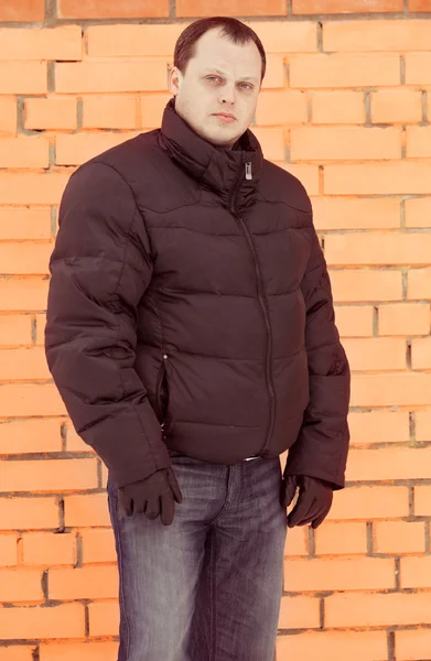 Portrait of a man in a black jacket on the street — Stock Photo, Image