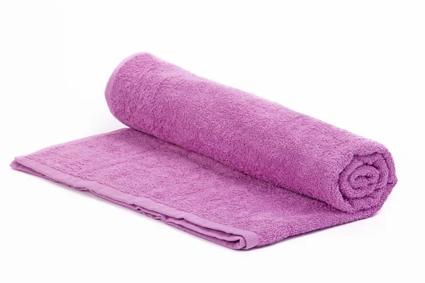 一个紫色毛巾卷在白色背景上 — 图库照片