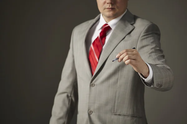 Businessman writing, drawing on the screen — Stock Photo, Image