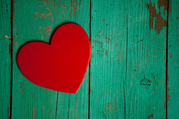 Srdce na dřevěném pozadí — Stock fotografie