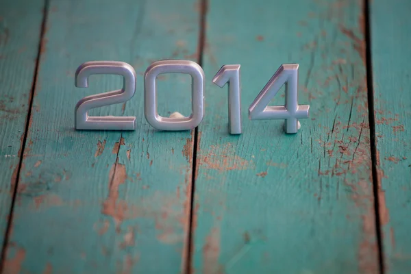 2014 sobre fondo de madera vieja — Foto de Stock