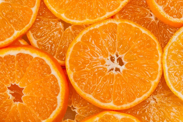 Achtergrond van segmenten van mandarijnen — Stockfoto