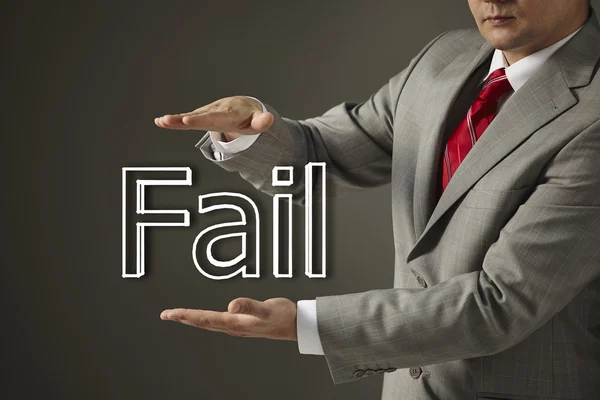 Businessman holding a word Fail . — Stock Photo, Image