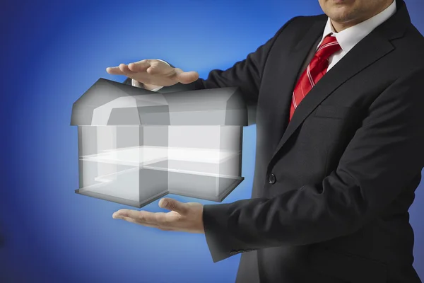 Business man presenting hand drawn simple house — Stock Photo, Image