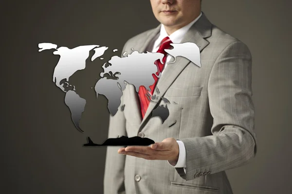 Businessman holding a drawing world map — Stock Photo, Image