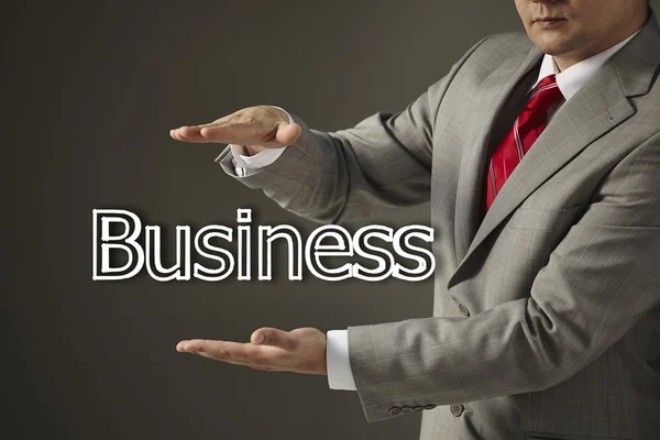 Businessman holding a word Business — Stock Photo, Image