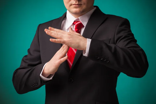 Businessman showing time out sign with hands — Stock Photo, Image