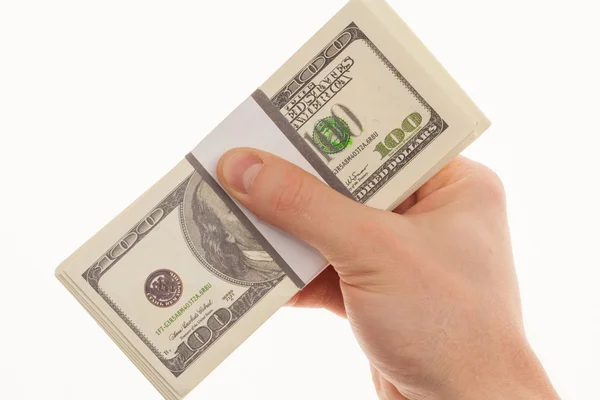 En mans hand håller en handfull dollar. — Stockfoto