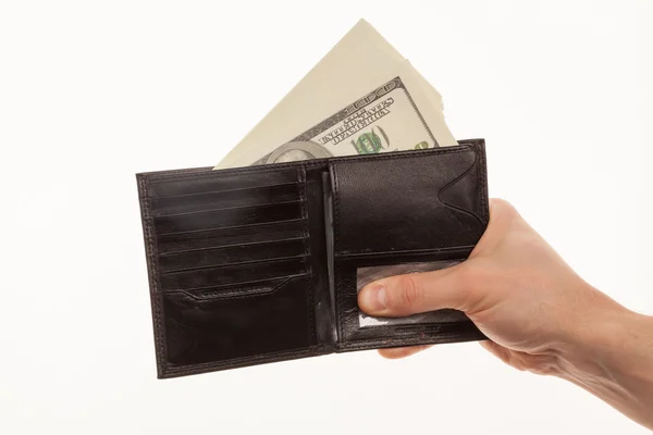 Hand holding a black wallet with money — Stock Photo, Image