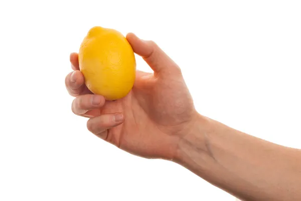 Man's hand holding a lemon isolated on a white background — Stock Photo, Image