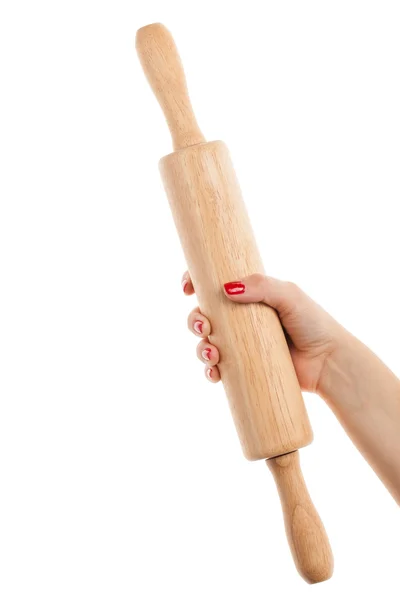 Woman hand with red manicure holding a rolling pin. Isolated on — Stock Photo, Image