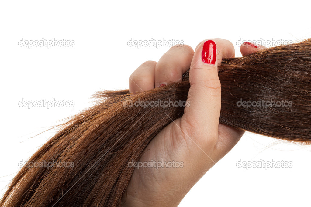 Woman hand holding hair.