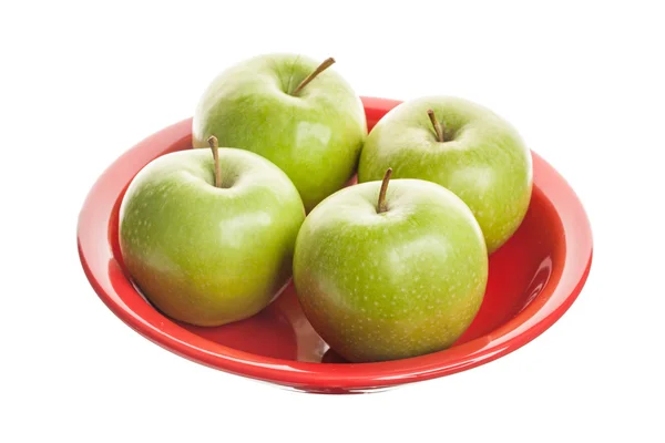 Gröna äpplen på tallrik. — Stockfoto