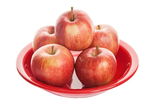 Röda appleson tallrik. — Stockfoto