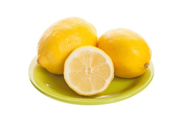 Fresh lemons in a plate — Stock Photo, Image
