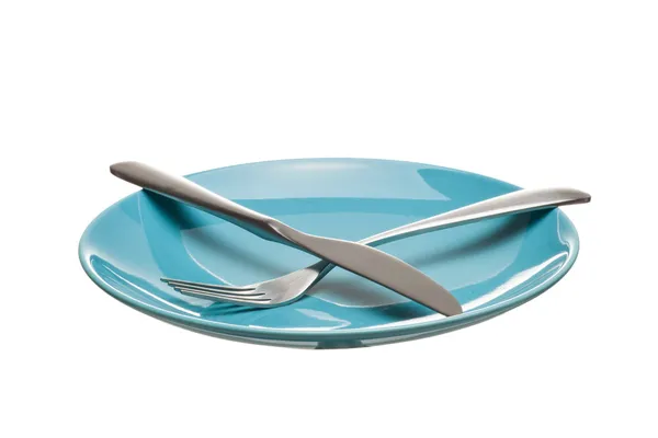 Blue empty plate with fork and knife isolated on a white backgro — Stock Photo, Image