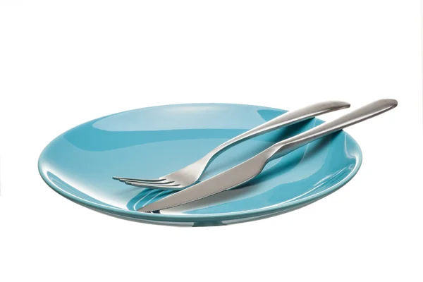 Blue empty plate with fork and knife isolated on a white backgro — Stock Photo, Image