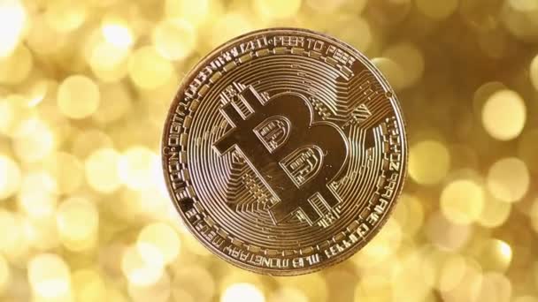 Bitcoin BTC Rotating Bitcoin Gold Coin Rotating on a Golden Background — Stock Video