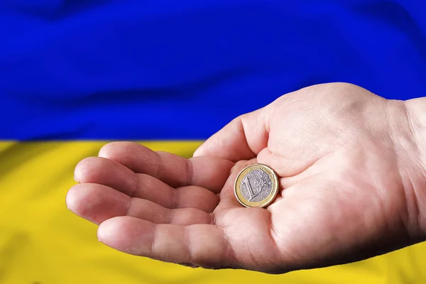 Coin One Euro Hand Man Flag Ukraine Background — Stock Fotó