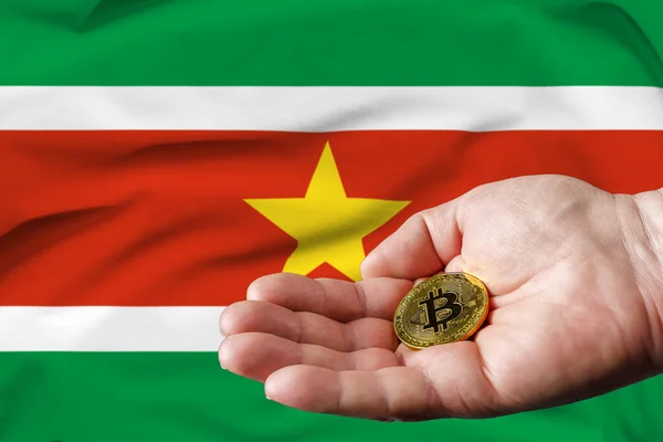 Golden Bitcoin Coin Mans Hand Suriname Flag Background — 图库照片
