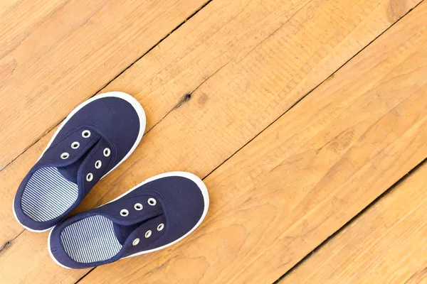 Shoes on wooden background — Stock Photo, Image