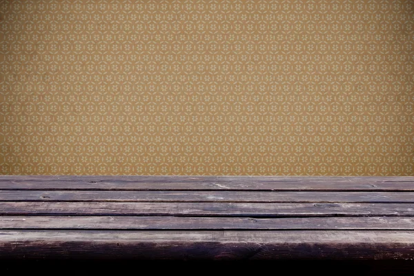 Old empty wooden table and vintage wallpaper with pattern — Stock Photo, Image