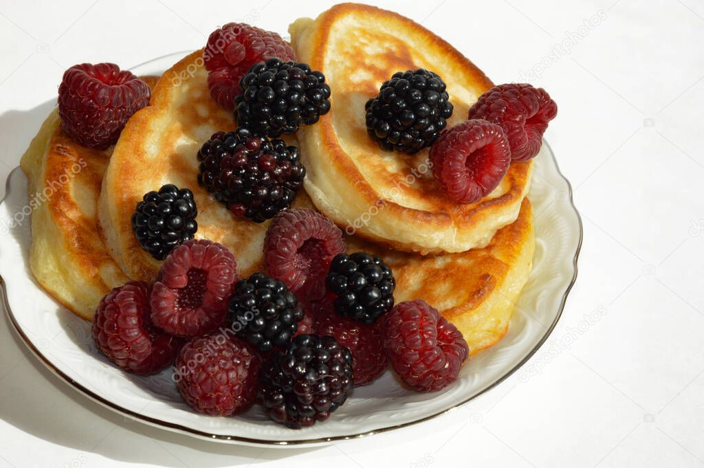 pancakes with fresh berries. breakfast food. dessert.