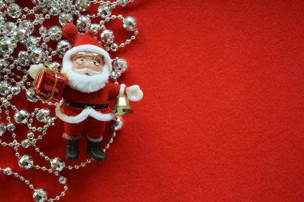 Toy Santa Claus Silver Beads Red Background Preparation Christmas New — Stock Photo, Image