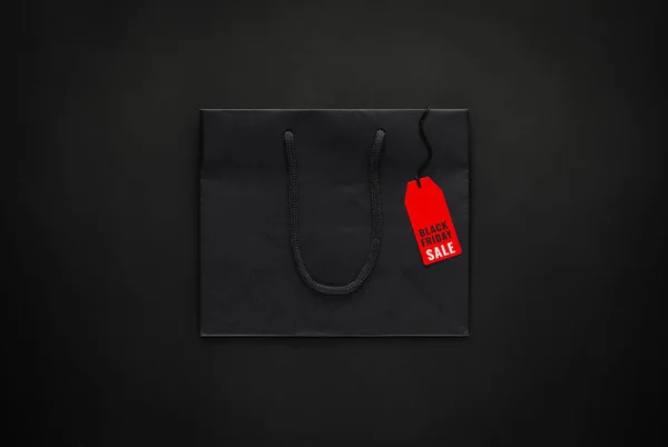 Black Shopping Paper Bag Red Price Tag Black Background Black — Stock Photo, Image