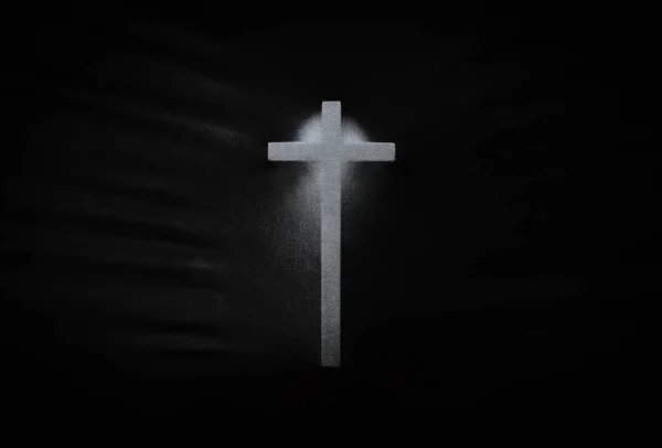 The cross pressing through black fabric with shine and dark side for Halloween background concept.