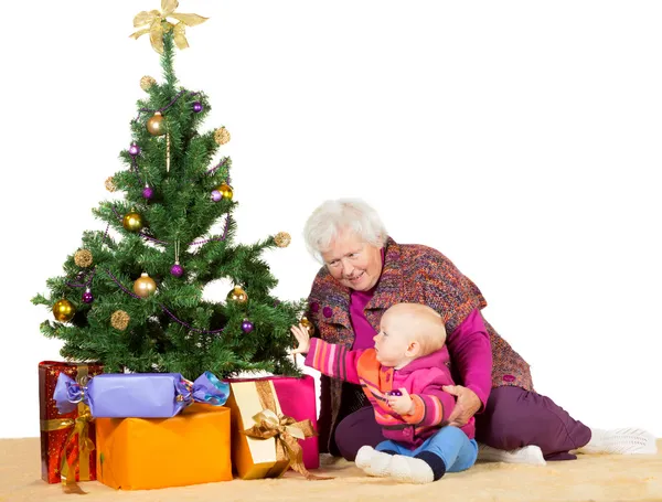 Granny and baby with Christmas tree — Stock Photo, Image