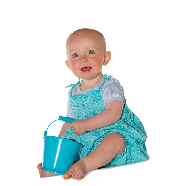 Adorable baby playing with a bucket — Stock Photo, Image