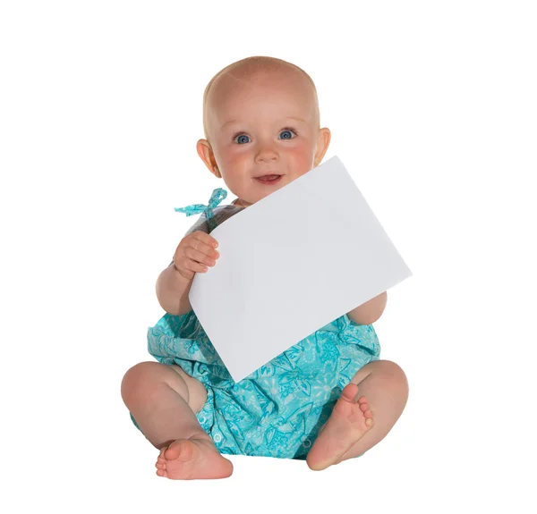 Cute young baby holding a sheet of paper — Stock Photo, Image