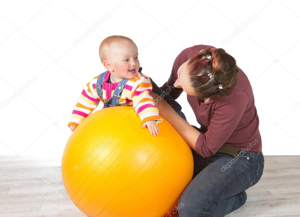 Devoted mother exercising her baby