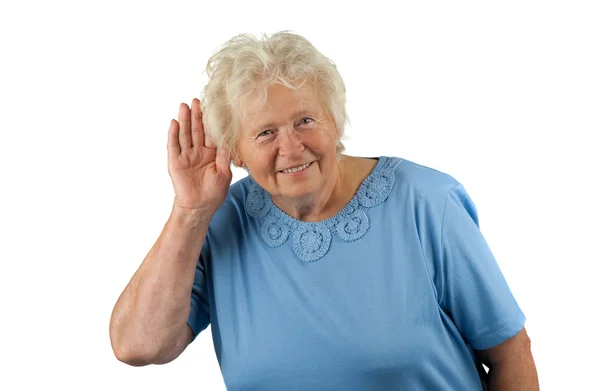Senior senhora com a mão na orelha, ouvindo algo — Fotografia de Stock